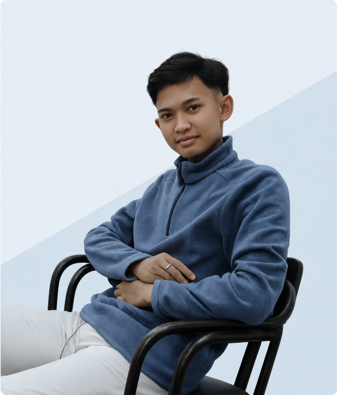 Hizkia Daud seated and wearing a blue jacket